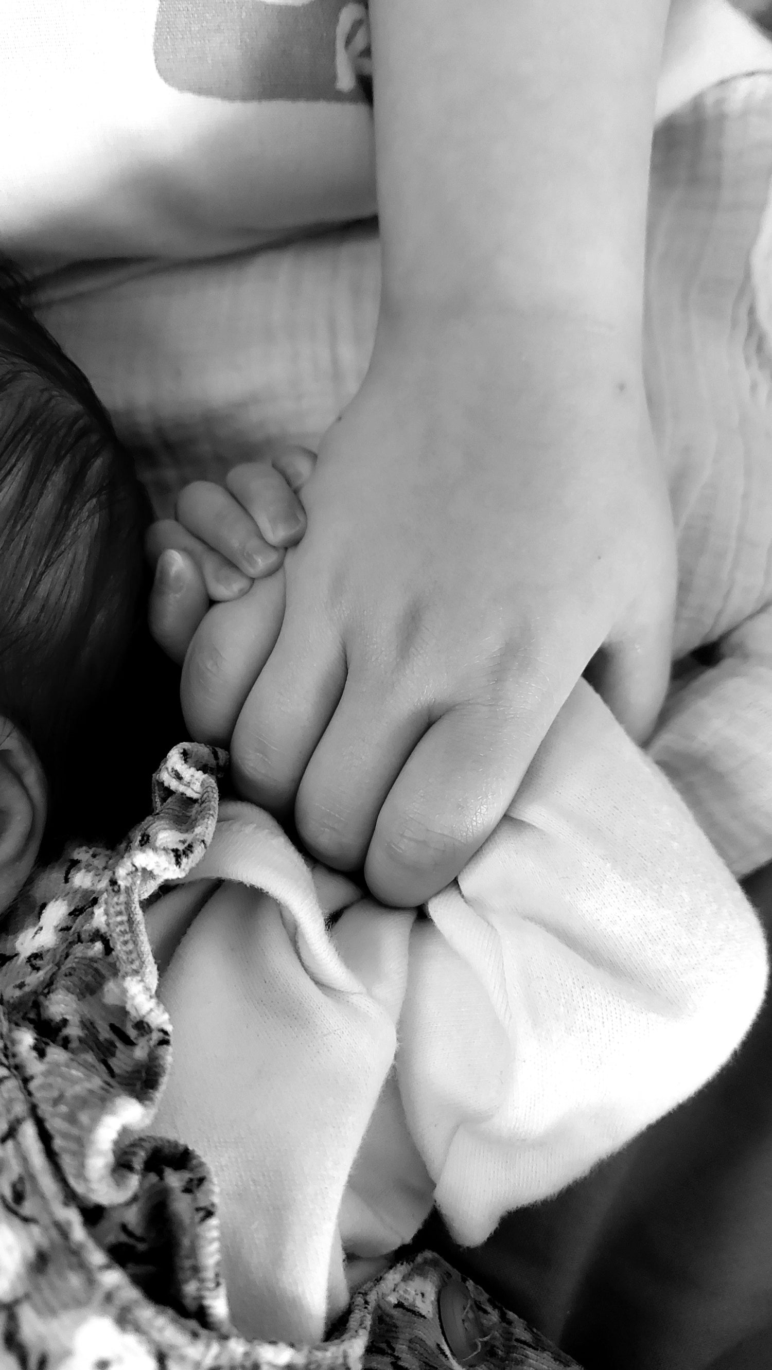 Baby and sibling holding hands. Baby boy, baby girl, newborn baby, sister, brother, love.