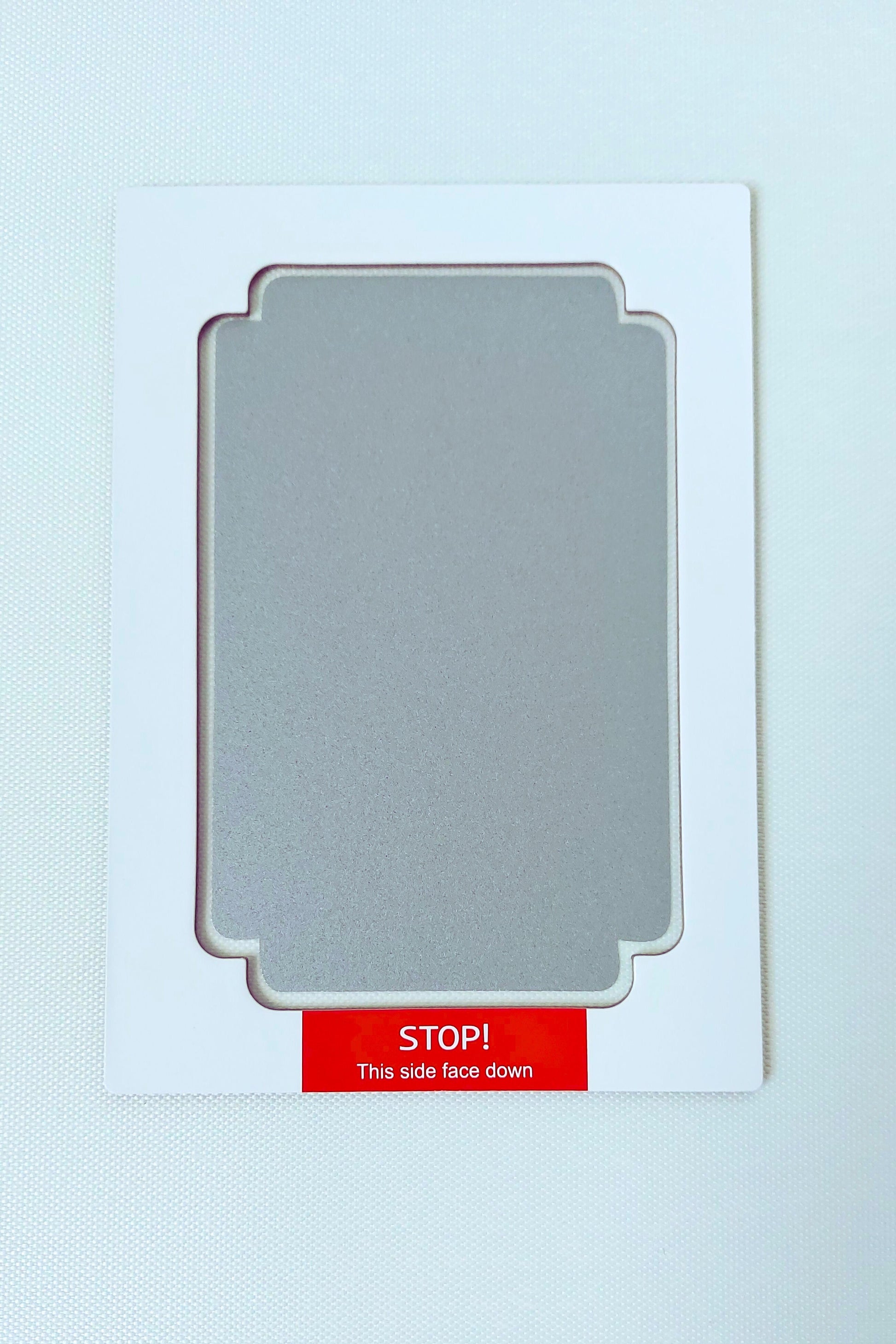 Clean Touch Mess Free Inkless Ink Pad in Grey Silver. Large Size. Baby safe, non toxic. On white background.