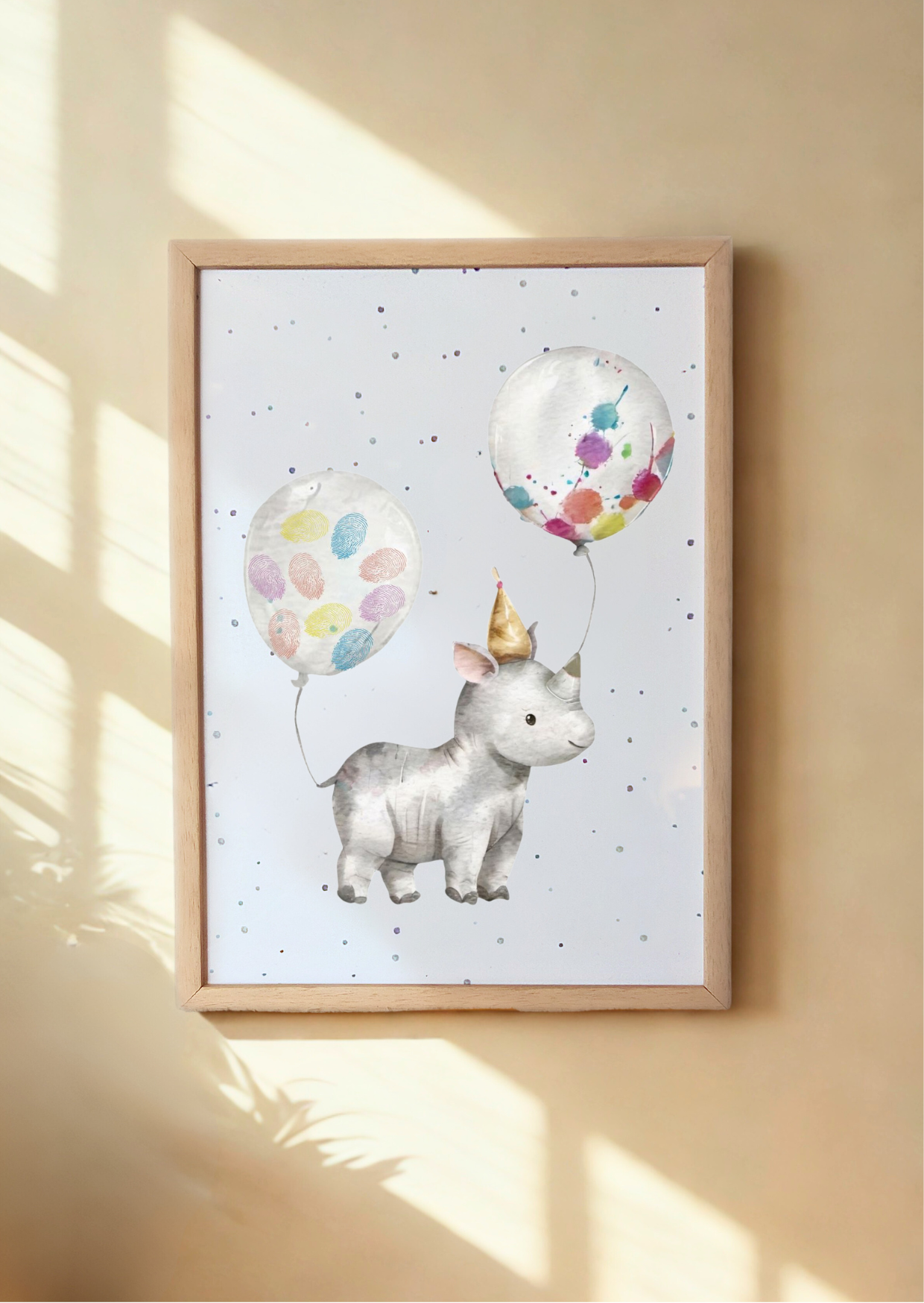 Framed artwork of a rhino with colorful balloons on a light background. Framed rhino keepsake prints with child's fingerprints as balloon decorations