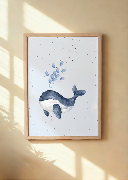 Framed artwork of a whale and bubbles on a white background, hanging on a beige wall. Framed Whale print with child's fingerprints as water