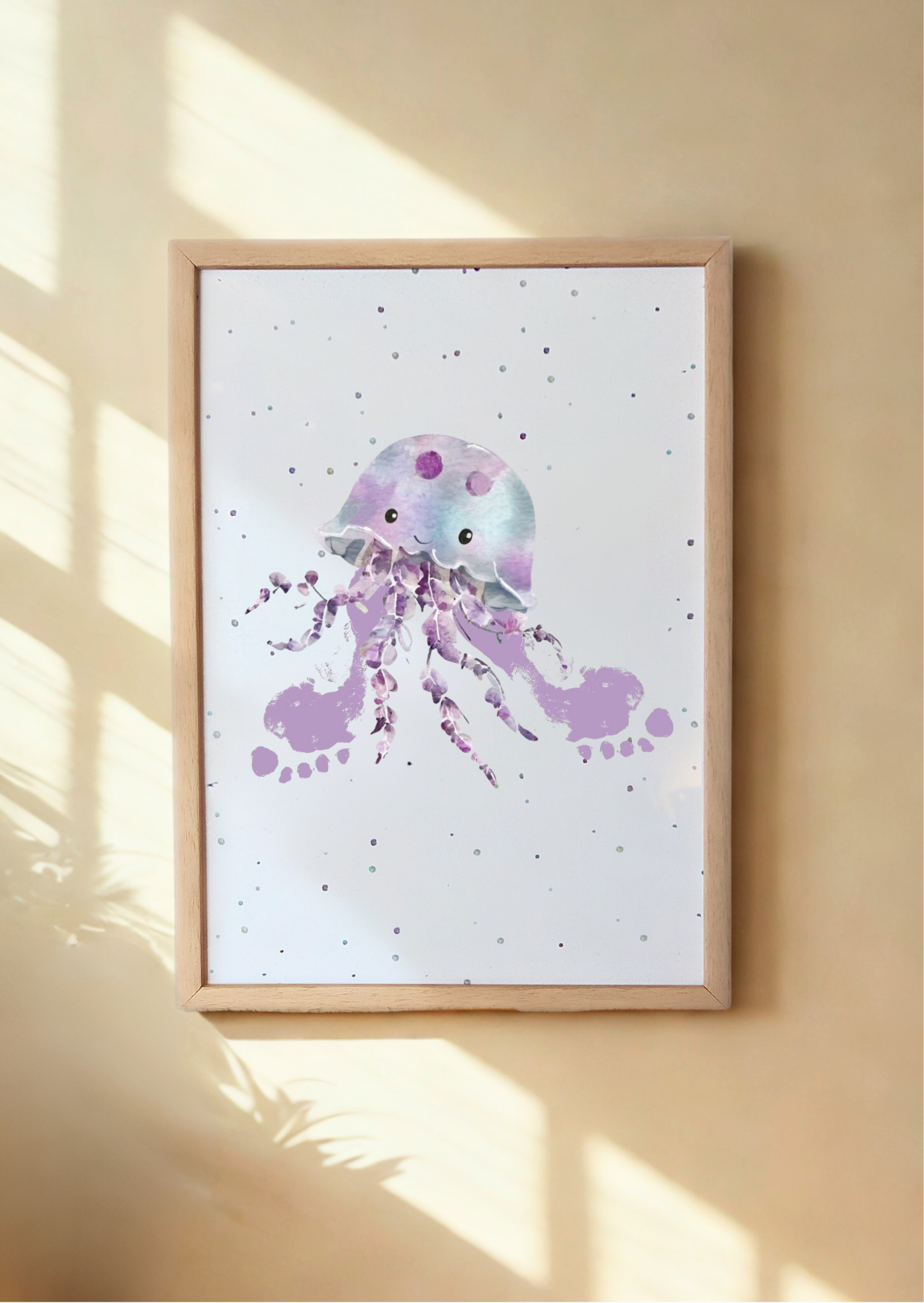 A framed print of a jellyfish with child's footprints as tentacles