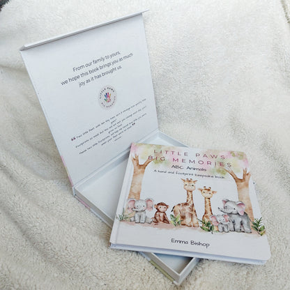 Little Paws Big Memories baby hand and footprint keepsake book front cover inside magnetic gift box. Ready to gift for Christening, new baby, baby shower etc. Newborn baby gift idea.