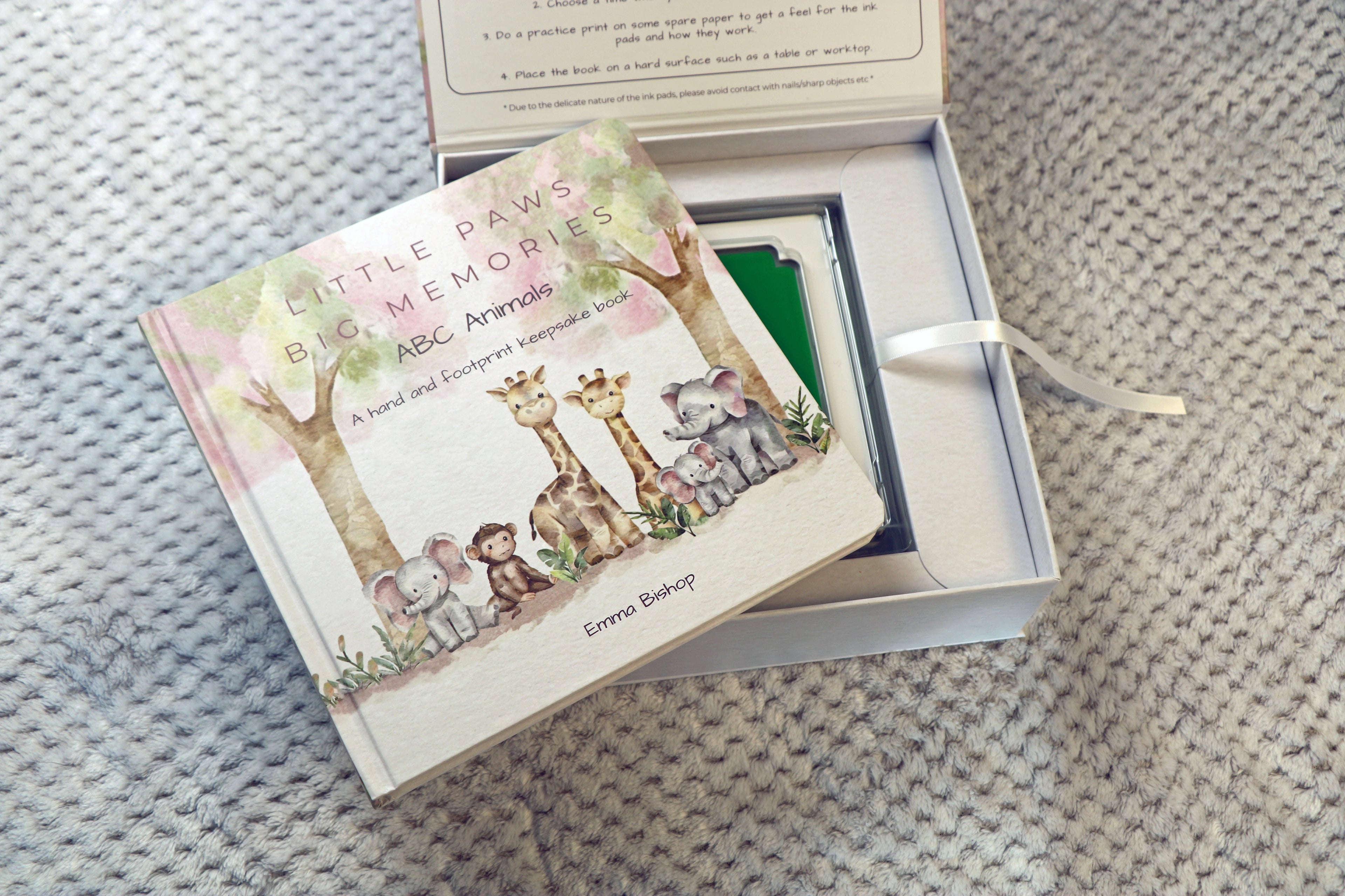 Little Paws Big Memories ABC Animals Starter Kit Box open with baby hand and footprint keepsake book on show with green clean touch ink pad