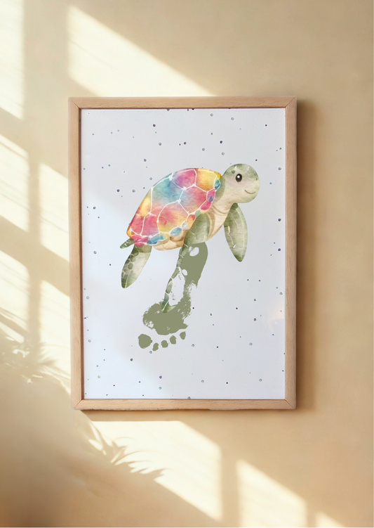 A framed print of turtle with a child's footprint as flipper